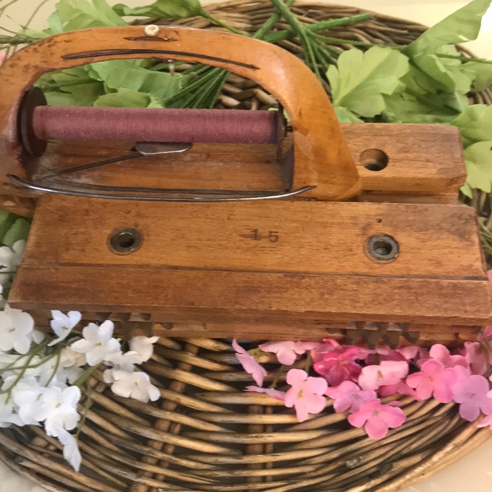 Antique wood shuttle with thread still attached
